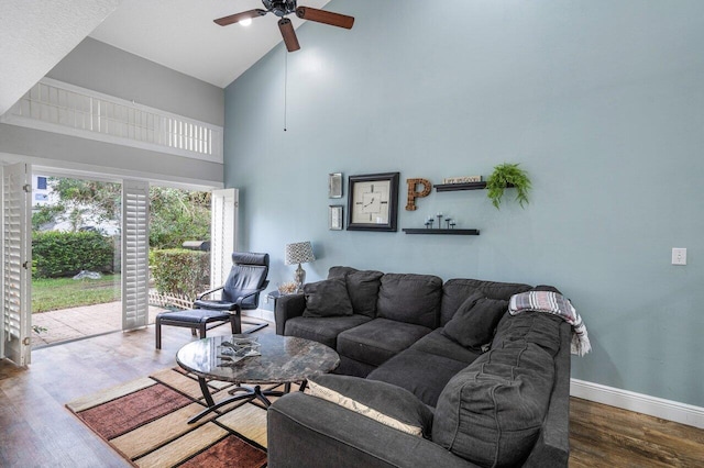 living room featuring wood-type flooring, high vaulted ceiling, and ceiling fan