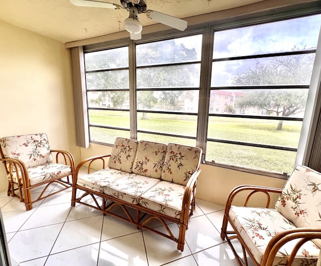 sunroom featuring ceiling fan