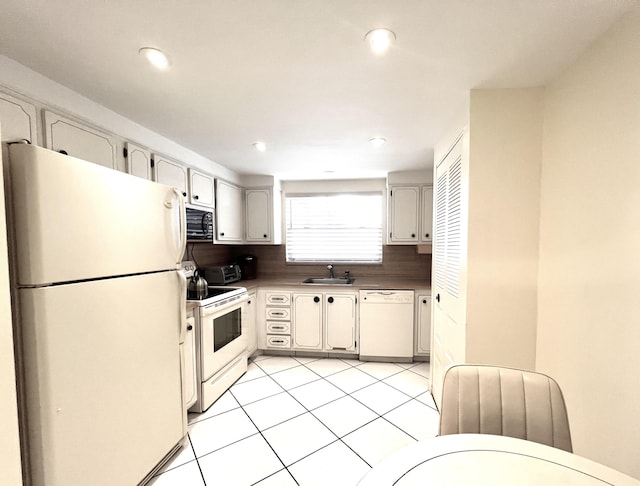 kitchen featuring sink, white cabinetry, light tile patterned floors, white appliances, and decorative backsplash