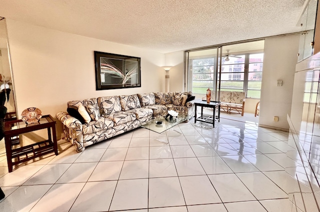 tiled living room featuring expansive windows and a textured ceiling