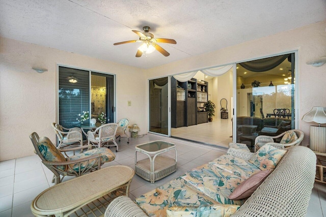 view of patio featuring ceiling fan