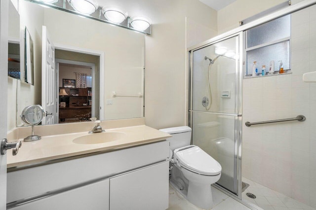 bathroom featuring vanity, toilet, an enclosed shower, and tile patterned flooring