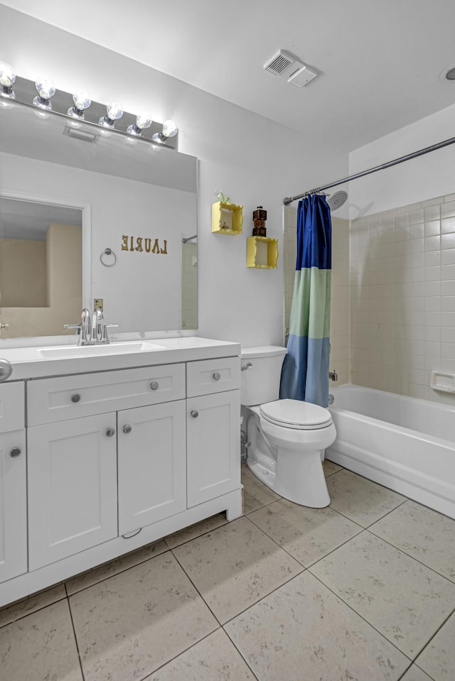 full bathroom featuring toilet, vanity, tile patterned floors, and shower / bath combo with shower curtain