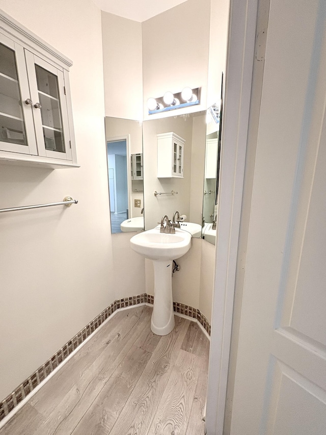 9189 Boca Gardens Cir Unit D, Boca Raton, FL 33496 - bathroom with wood finished floors and baseboards