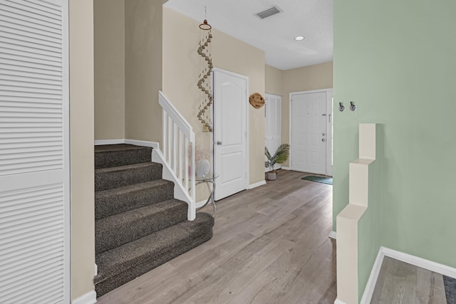 entrance foyer with light hardwood / wood-style flooring