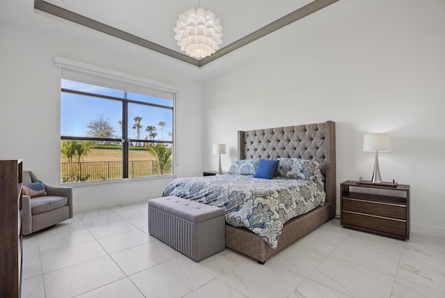 bedroom featuring a raised ceiling