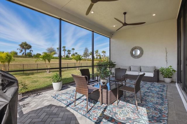 sunroom / solarium with ceiling fan