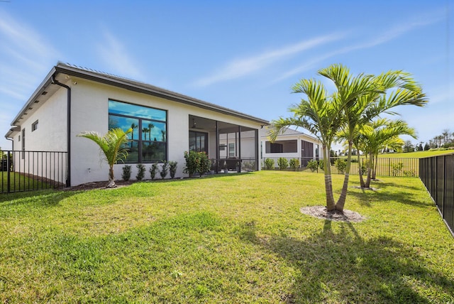 view of yard featuring a sunroom