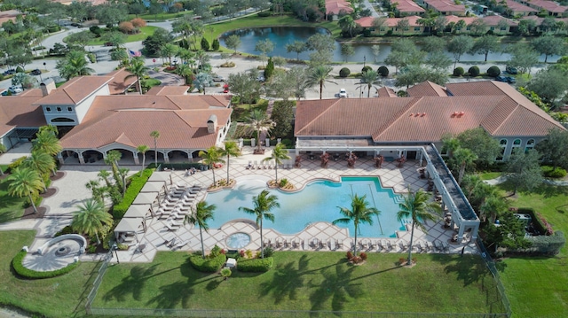 birds eye view of property with a water view