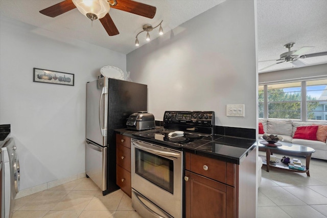 bedroom with ceiling fan, light tile patterned floors, a textured ceiling, and access to outside