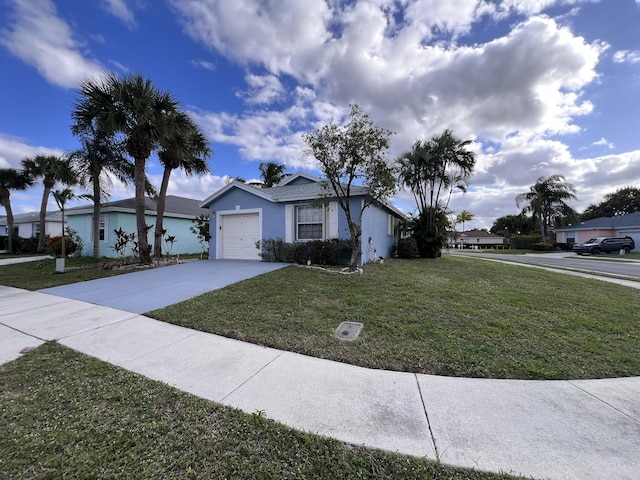 view of front of home with a garage and a front yard