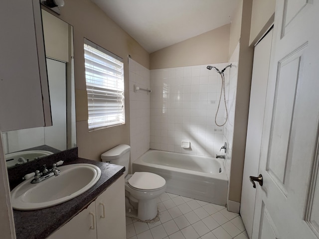 full bathroom featuring tile patterned flooring, vanity, vaulted ceiling, toilet, and tiled shower / bath