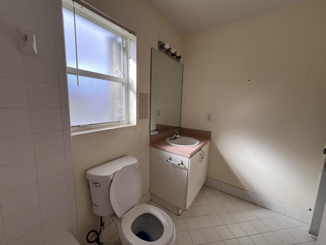 bathroom with tile patterned floors, vanity, and toilet