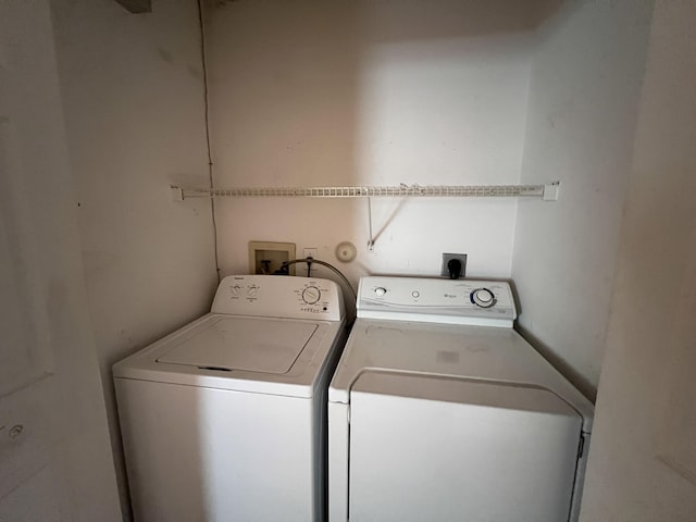 clothes washing area with independent washer and dryer