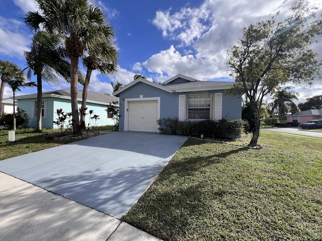 view of front of house featuring a garage and a front yard