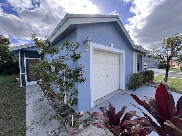 view of side of property featuring a garage