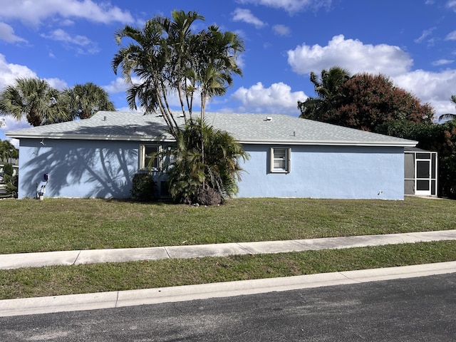 view of property exterior with a yard