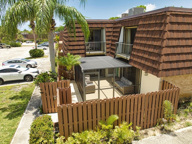 view of side of home featuring a patio area