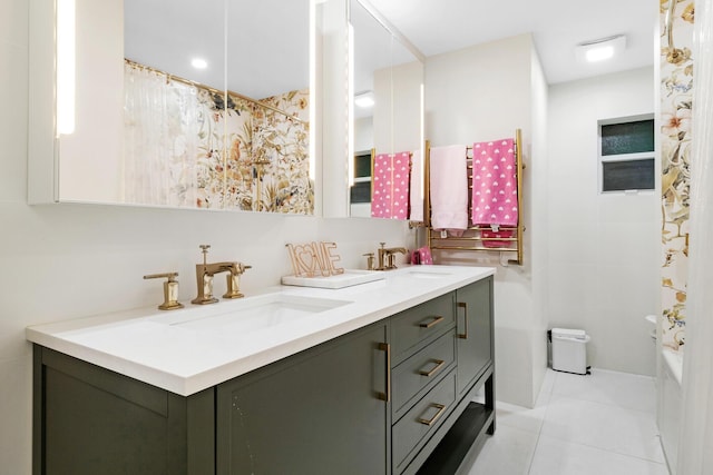 bathroom featuring tile patterned floors, vanity, and shower / bathtub combination with curtain