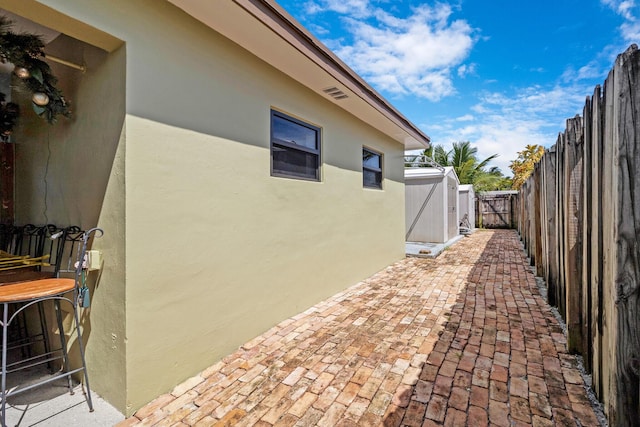 view of side of property featuring a patio area