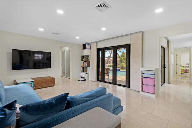 tiled living room featuring french doors