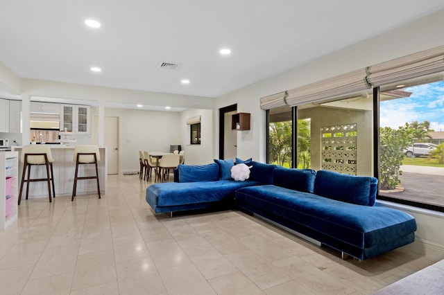 living room with light tile patterned floors