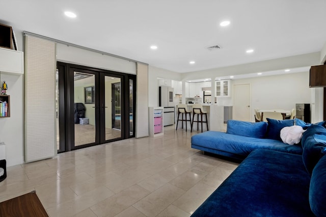 tiled living room with french doors