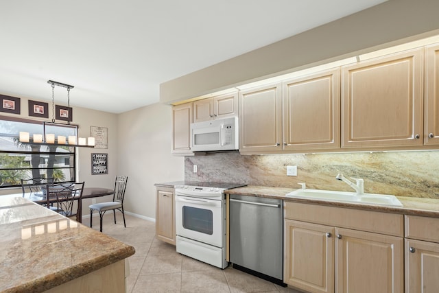 kitchen with pendant lighting, sink, backsplash, light tile patterned floors, and white appliances