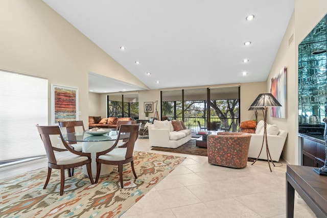 tiled living room featuring high vaulted ceiling