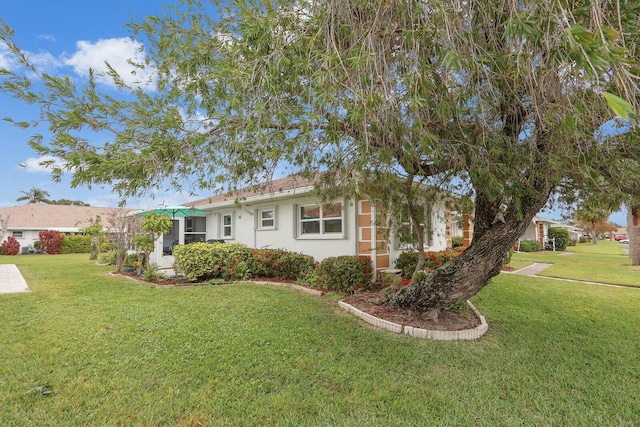 view of front of home with a front lawn