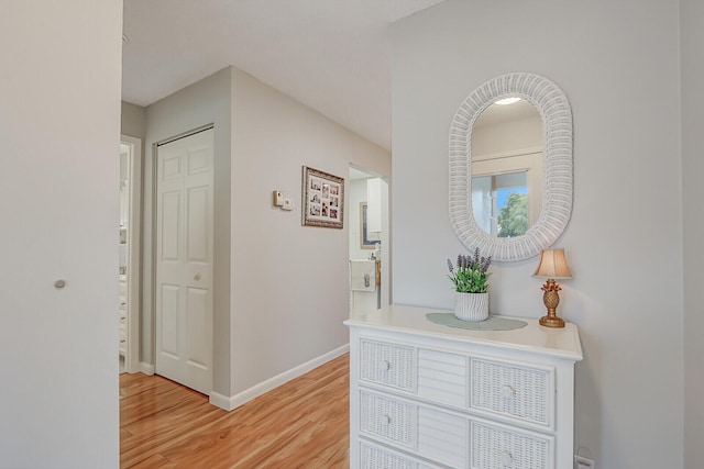 hall with light hardwood / wood-style floors