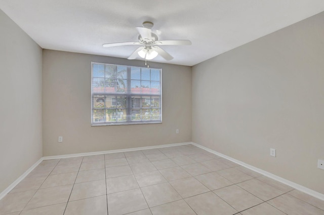 spare room with light tile patterned floors and ceiling fan