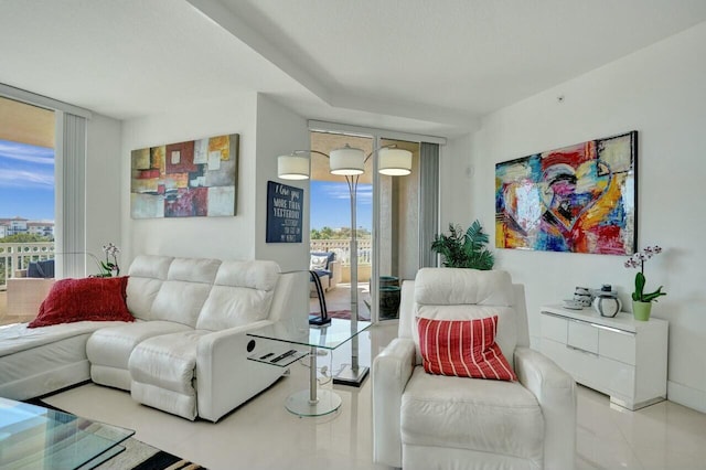 tiled living room featuring expansive windows and plenty of natural light