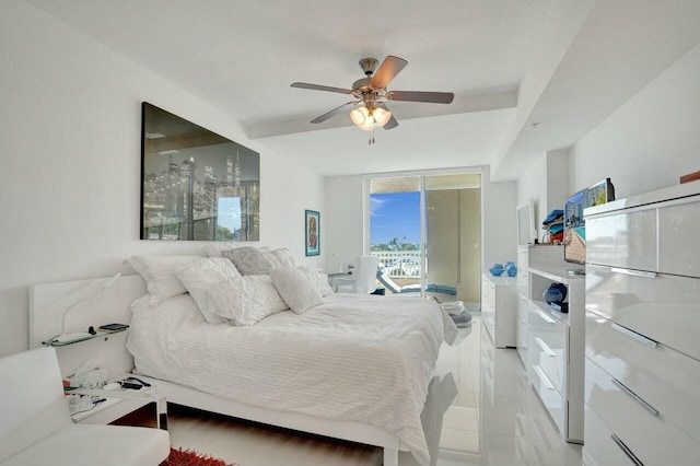 bedroom featuring ceiling fan and access to outside