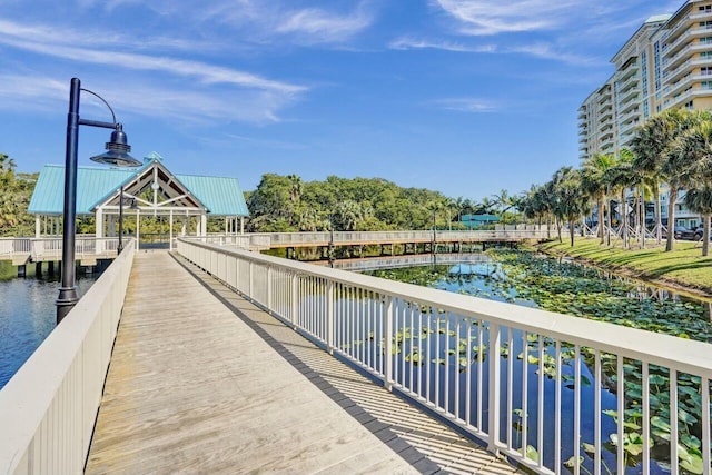 view of dock featuring a gazebo and a water view