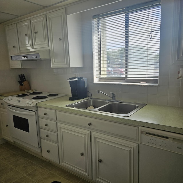 kitchen featuring white cabinetry, sink, white appliances, and decorative backsplash