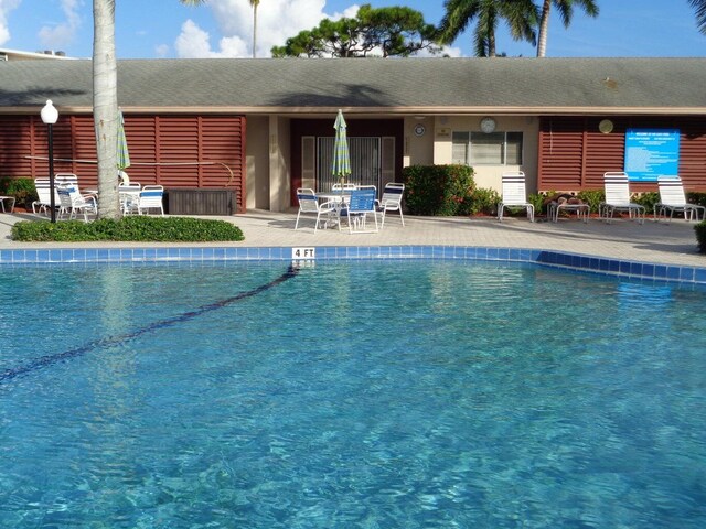 pool with a patio area