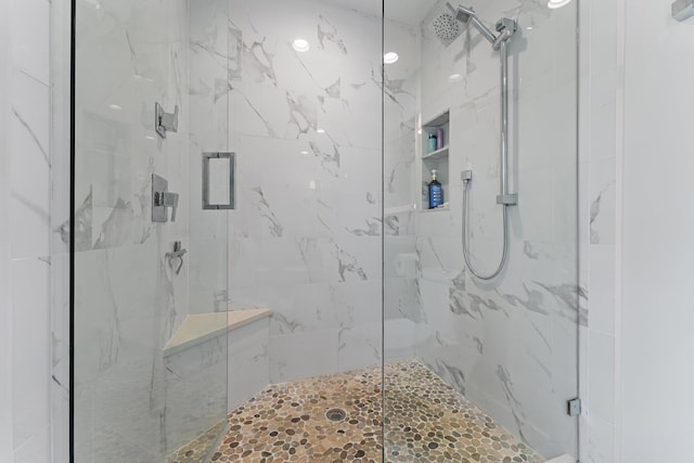 bathroom with a shower with shower door