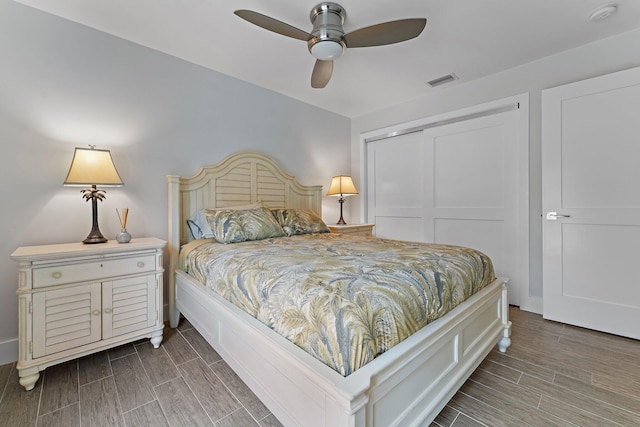 bedroom with ceiling fan and a closet