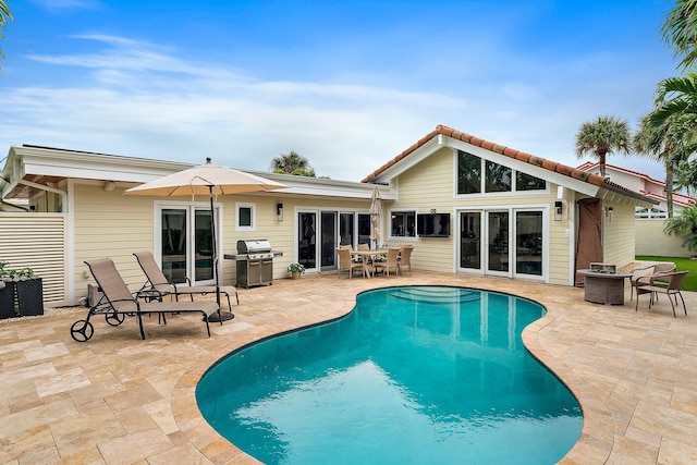 rear view of property with a patio