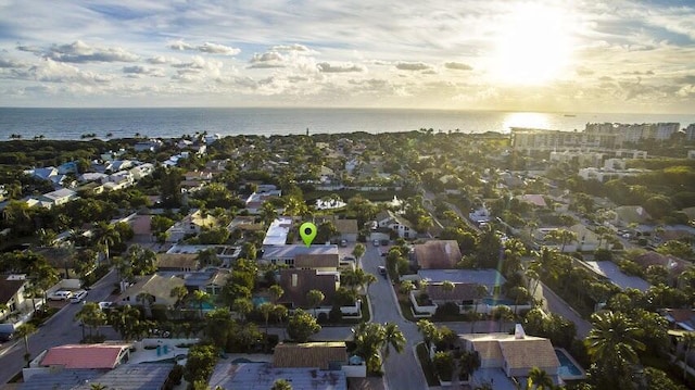 aerial view at dusk with a water view