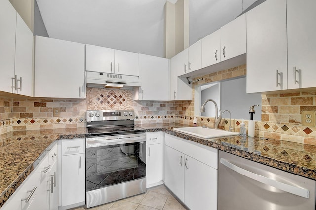 kitchen featuring white cabinetry, appliances with stainless steel finishes, sink, and dark stone countertops