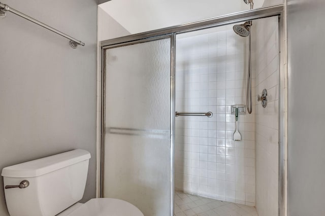 bathroom with walk in shower and toilet