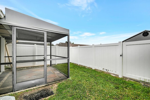 view of yard with a patio and a sunroom