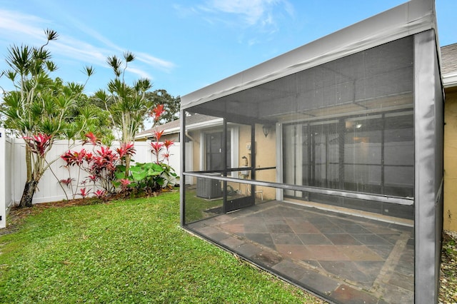 view of yard with cooling unit and a patio area