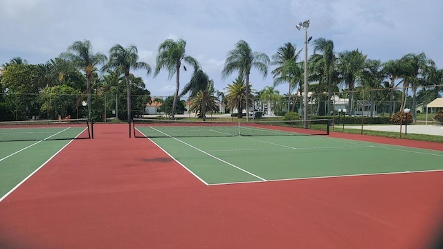 view of sport court featuring basketball hoop