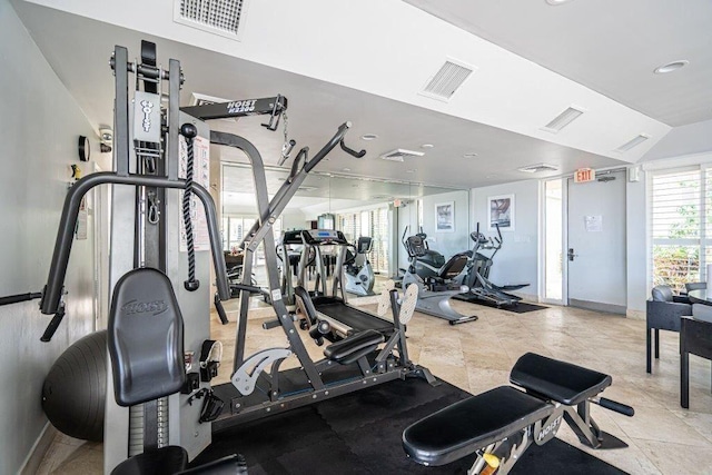 gym featuring lofted ceiling