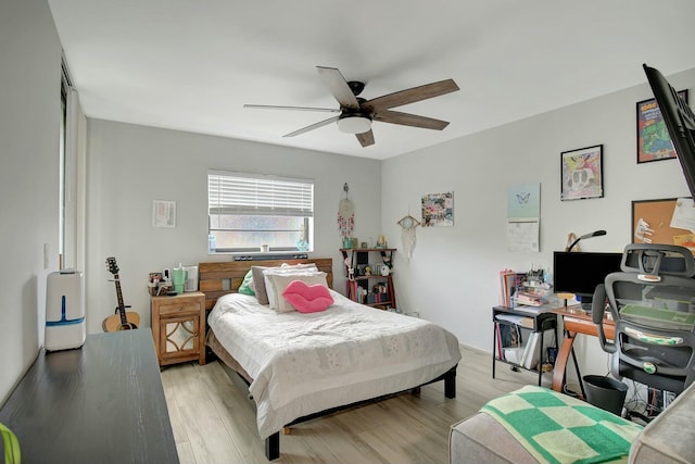 bedroom with ceiling fan and light wood-type flooring