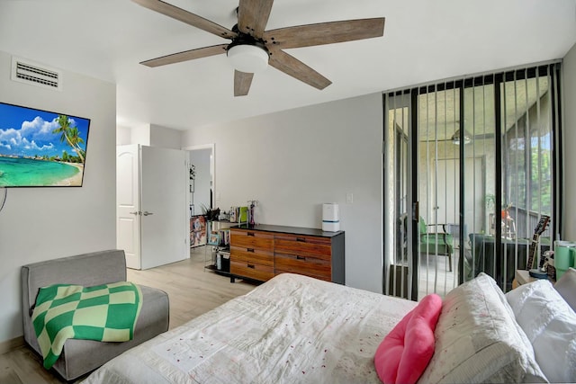 bedroom featuring access to outside, ceiling fan, and light hardwood / wood-style floors