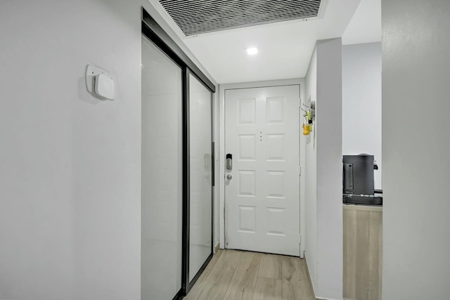 hall featuring light hardwood / wood-style flooring